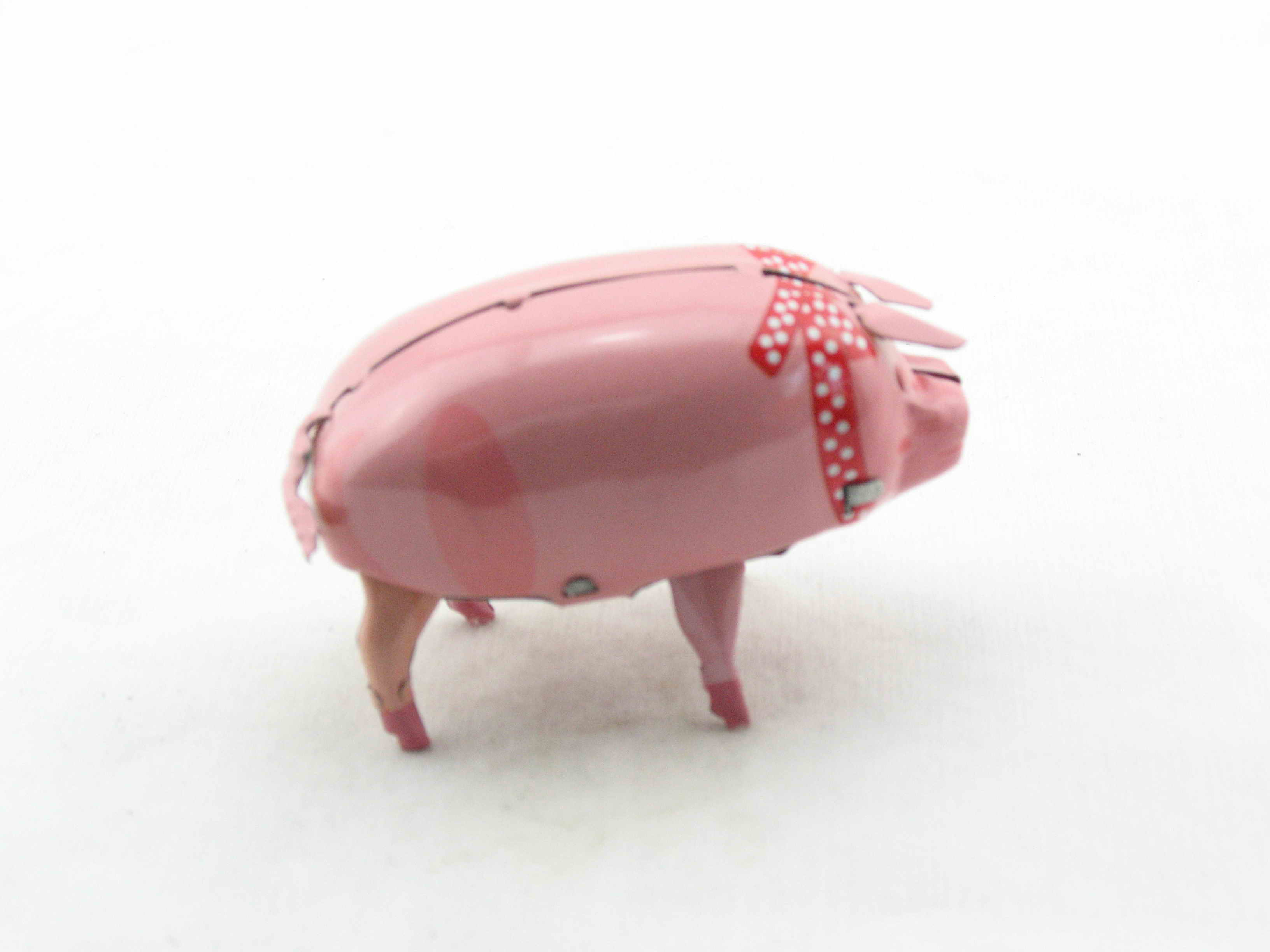 Blechspielzeug - Schwein Polly mit roter Schleife
