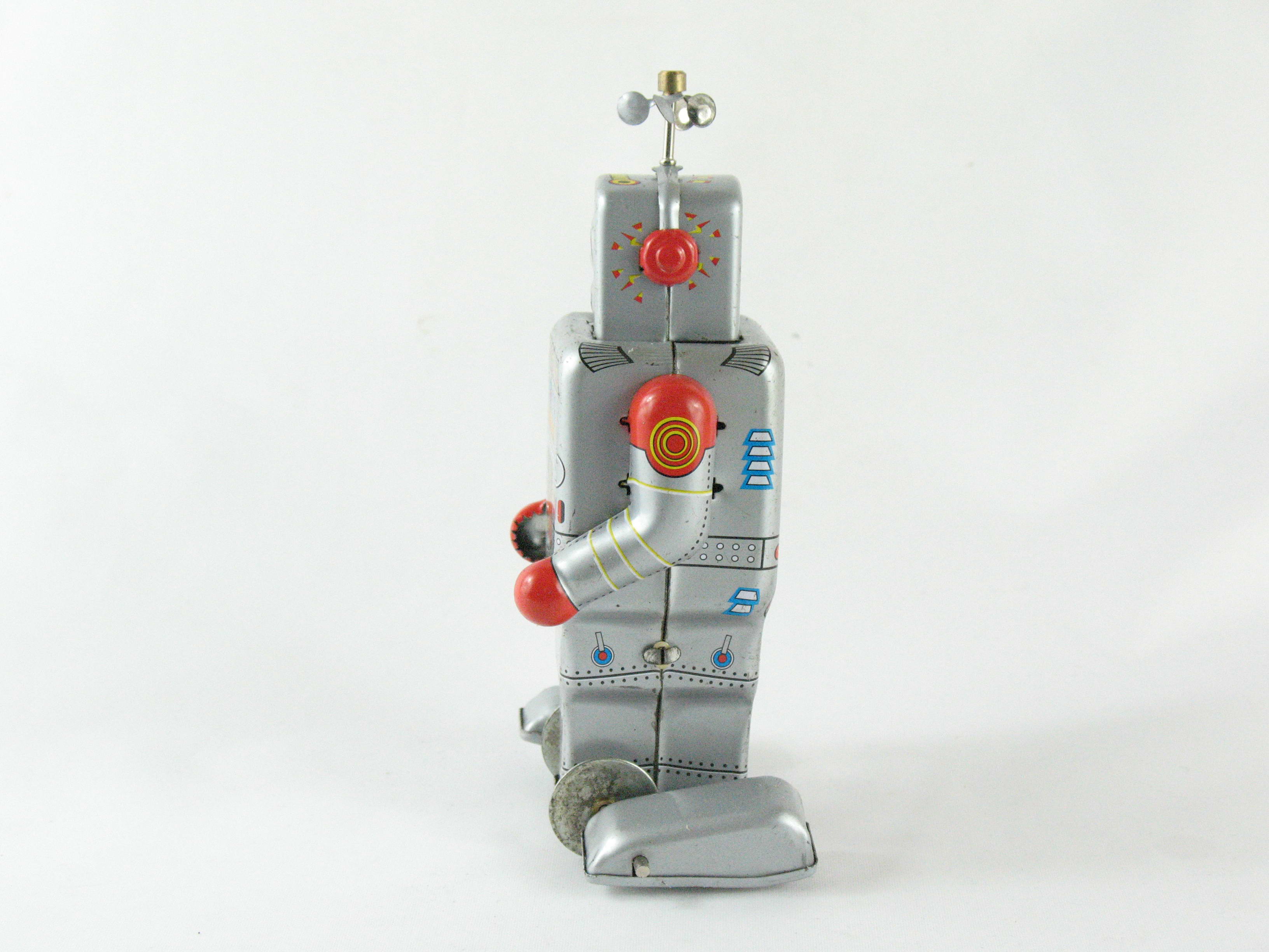 Blechspielzeug - Roboter auf Raupenfüßen, silber/rot